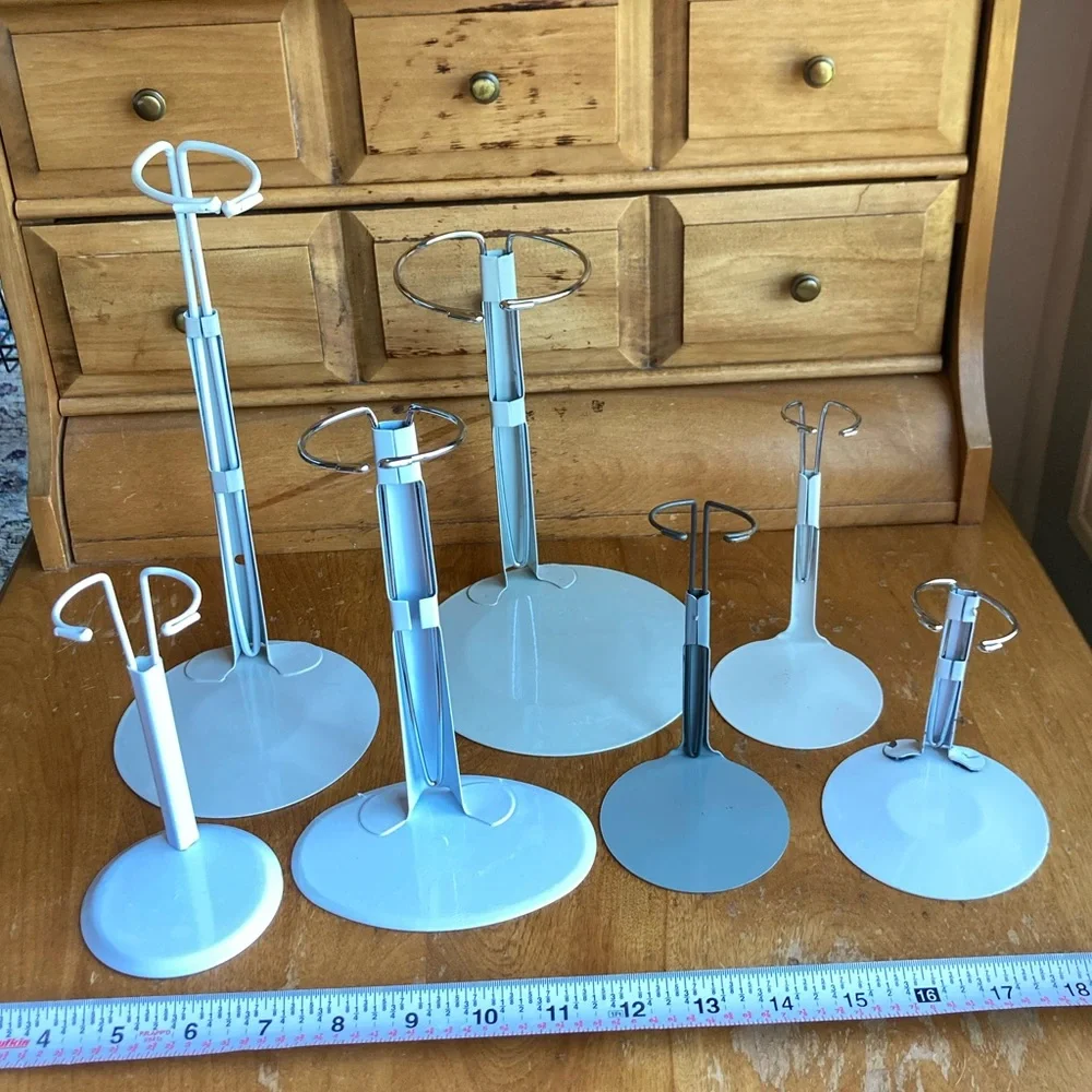 7 doll holders or White and Gray Jewelry Stands